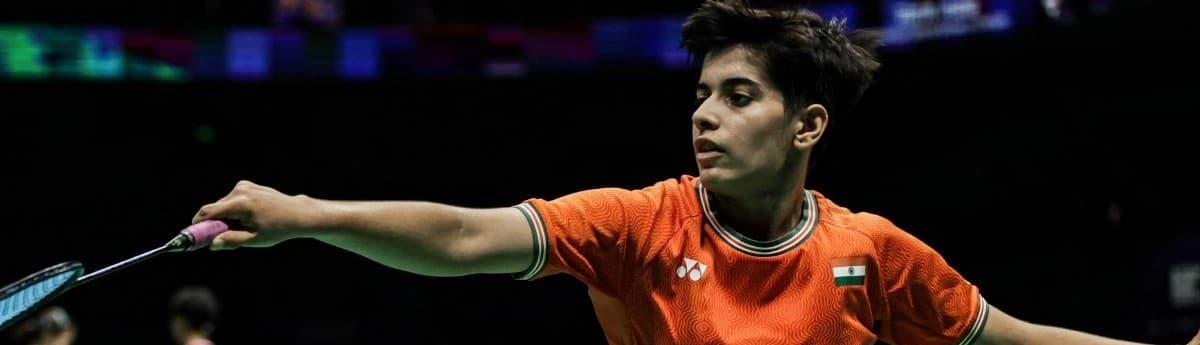 Action shot of Anmol Kharb at the net